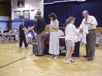 Receiving their certificates and T-shirts